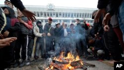 Protesters gather in front of the Kyrgyz government headquarters on the central square in Bishkek, Kyrgyzstan, Oct. 6, 2020. (AP)