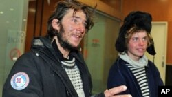 Norwegian adventurers Jarle Andhoy (L) and Samuel Massie (R) said they held slim hopes of finding the three other members of their party alive after their yacht went missing in a fierce Antarctic storm, Feb. 28, 2011