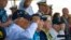 FILE - Pearl Harbor survivors, from left, Harry Chandler, Ken Stevens, Herb Elfring and Ira "Ike" Schab salute while the national anthem is played during the 82nd Pearl Harbor Remembrance Day ceremony on Dec. 7, 2023, at Pearl Harbor in Honolulu, Hawaii.