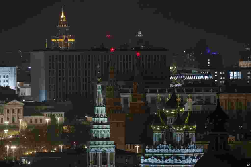 The Kremlin's Towers and a church are seen in darkness after the lights were turned off to mark Earth Hour in Moscow, Russia, March 25, 2017. 