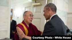 President Barack Obama greets His Holiness the Dalai Lama at the entrance of the Map Room of the White House, June 15, 2016. 