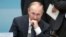 Russian President Vladimir Putin sits before the start of the opening ceremony of the G-20 Summit in Hangzhou in eastern China's Zhejiang province, Sunday, Sept. 4, 2016.