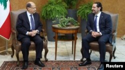 Lebanese President Michel Aoun meets with Prime Minister Saad al-Hariri at the presidential palace in Baabda, Lebanon Nov. 27, 2017.