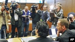 Rami Makanesi, foreground left, awaits the beginning of his trial at a court in Frankfurt, Germany, May 5, 2011