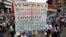 FILE - Opposition supporters rally against President Nicolas Maduro carrying a sign that reads "Venezuela is wounded in the heart with hunger, misery, corruption and dictatorship", in Caracas, Venezuela, May 10, 2017. 