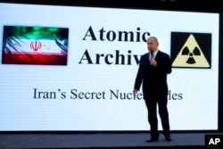 Israeli Prime Minister Benjamin Netanyahu presents material on Iranian nuclear weapons development during a press conference in Tel Aviv, Monday, April 30 2018.