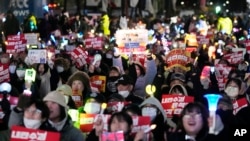 Participants stage a rally to demand South Korean President Yoon Suk Yeol's impeachment outside the National Assembly in Seoul, South Korea, Dec. 9, 2024.