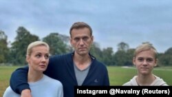 GERMANY -- Russian opposition politician Aleksey Navalny, his wife Yulia and son Zakhar pose for a picture in Berlin, in this undated image obtained from social media October 6, 2020