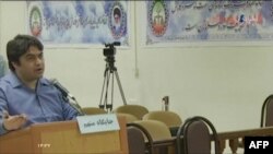 FILE - An image grab from footage obtained from Iranian State TV IRIB shows Ruhollah Zam, a former opposition figure who had lived in exile in France and was implicated in anti-government protests, speaking in a courtroom during a trial.