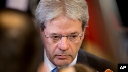 FILE - Italian Foreign Minister Paolo Gentiloni, shown at an EU foreign ministers meeting in Brussels in January, says 'the idea that there's an active terrorist threat only a few hours from Italy by boat' is unacceptable.