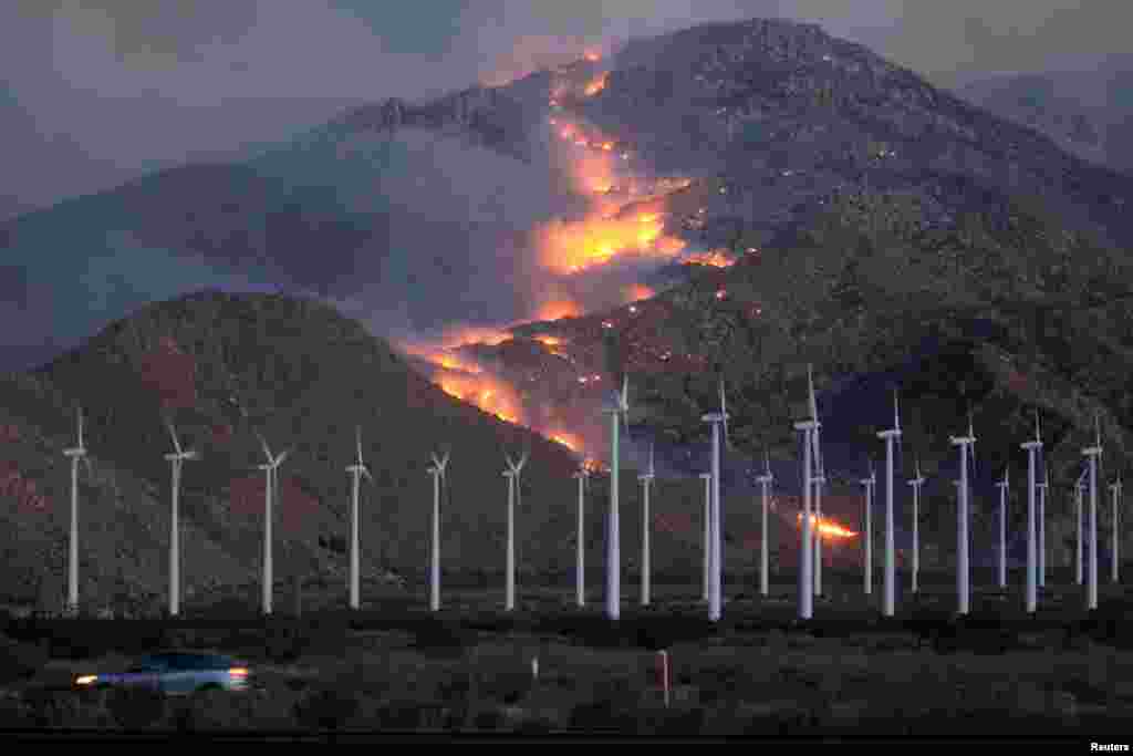 Fire spreads up the north side of the San Jacinto Mountains near Banning, California, August 8, 2013. 