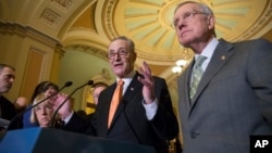 FILE - Sen. Chuck Schumer, D-N.Y., center, flanked by Senate Minority Leader Harry Reid, D-Nev., right, and Sen. Patty Murray, D-Wash., left, speaks with reporters just before Democrats blocked legislation from the GOP-led House on a bill that would crack down on Syrian and Iraqi refugees entering America, at the Capitol in Washington, Jan. 20, 2016.