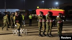 The body of late Ghanaian soccer player, Christian Atsu Twasam, 31, who died in the earthquake in Turkey, arrives at the Kotoka International Airport in Accra, Ghana. February 19, 2023.