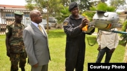 Ugandan Prime Minister Amama Mbabazi inspects Chris Nsamba's space probe in March, 2013. (Photo: African Space Research Program)