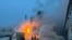 Пожежники гасять пожежу на терміналі "Новатек" в порту Усть-Луга, 21 січня 2024 року. (Фото з Telegram-каналу губернатора Ленінградської області Олександра Дрозденка через REUTERS)