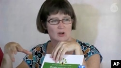 FILE - In this image made from video by Radio Free Asia, former British Ambassador Vicky Bowman talks to reporters in Yangon, Myanmar, on Sept. 5, 2014. (Radio Free Asia via AP)