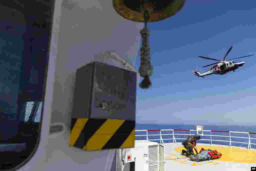 A pregnant woman from&nbsp;Tunisia,&nbsp;whose pregnancy is at high risk,&nbsp;is prepared to be evacuated&nbsp;by an Italian coast guard helicopter&nbsp;from the Ocean Viking,&nbsp;a migrant search and rescue ship, off Italian coasts.&nbsp;Her husband, daughter, 7, and son, 2, were left behind on the ship.&nbsp;