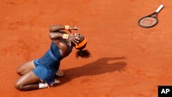 FILE - Serena Williams celebrates as she defeats Russia's Maria Sharapova during the women's final match of the French Open tennis tournament at Roland Garros stadium June 8, 2013, in Paris.