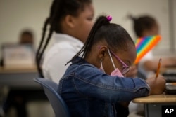 Students work in a classroom at Beecher Hills Elementary School on Friday, Aug. 19, 2022, in Atlanta.