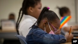 Students work in a classroom at Beecher Hills Elementary School on Friday, Aug. 19, 2022, in Atlanta.