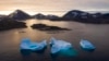 FILE - Large icebergs float as the sun rises near Kulusuk, Greenland, Aug. 16, 2019. 