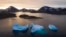 FILE - Large icebergs float as the sun rises near Kulusuk, Greenland, Aug. 16, 2019. 