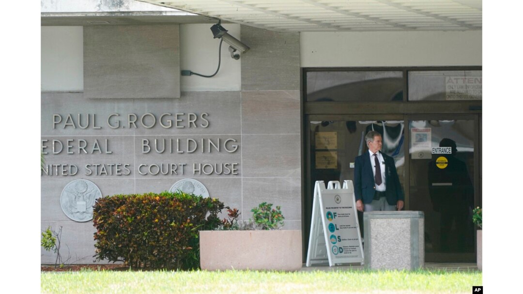A security guard stands outside the Paul G. Rogers Federal Building and U.S. Courthouse, in West Palm Beach, Fla., Sept. 1, 2022.