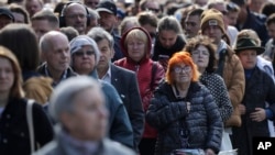 People line up to pay the last respects at the coffin of former Soviet President Mikhail Gorbachev outside the Pillar Hall of the House of the Unions during a farewell ceremony in Moscow, Russia, Sept. 3, 2022. Gorbachev died Tuesday at the age of 91. 