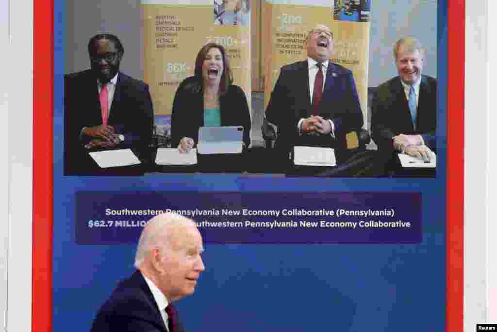 Southwestern Pennsylvania New Economy Collaborative officials react to a funny comment by U.S. President Joe Biden during an event to discuss his &quot;American Rescue Plan&quot; investments in area communities, at an auditorium on the White House campus in Washington.