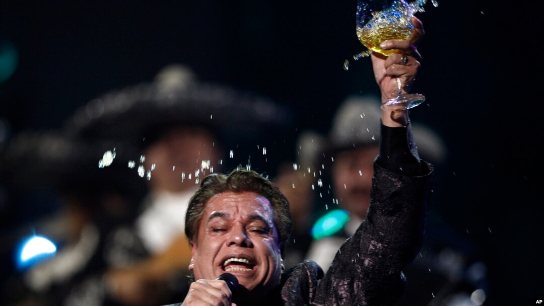 Obit Juan Gabriel: FILE - In this Nov. 5, 2009, file photo, Juan Gabriel performs at the 10th Annual Latin Grammy Awards in Las Vegas. The press office for Mexican superstar Gabriel says the singer has died at age 66. 