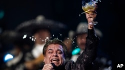 Obit Juan Gabriel: FILE - In this Nov. 5, 2009, file photo, Juan Gabriel performs at the 10th Annual Latin Grammy Awards in Las Vegas. The press office for Mexican superstar Gabriel says the singer has died at age 66. 