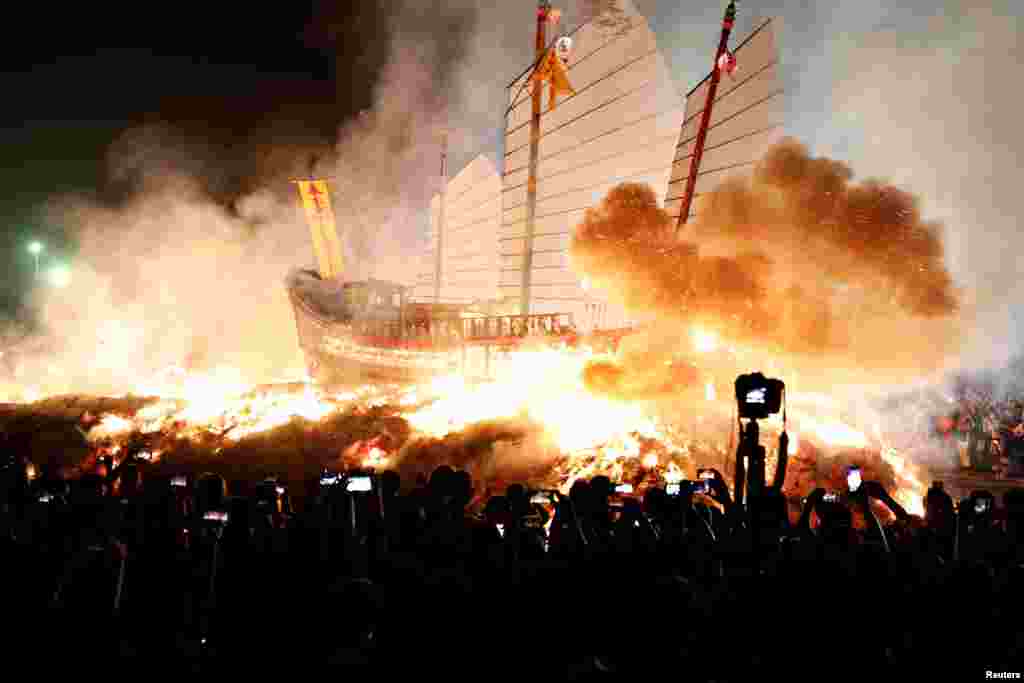 &#39;Wang Yeh&#39;s Boat&#39;, a 13-meter finely crafted ancient warship made of paper and wood, sets on fire to ward off evil, disease and bad luck during Wang Yeh Boat Burning Festival, in Pingtung, Taiwan.