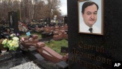 FILE - A tombstone on the grave of lawyer Sergei Magnitsky who died in jail, at a cemetery in Moscow.