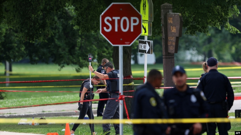 Police investigate a crime scene where a man was fatally shot. 