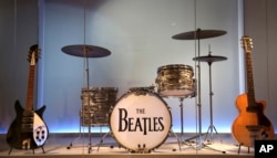 Instruments used by members of The Beatles are displayed at the exhibit "Play It Loud: Instruments of Rock & Roll" at the Metropolitan Museum of Art in New York, April 1, 2019.