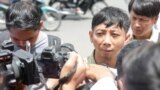 Pa Nguon Teang, founder and executive director of the Cambodian Center for Independent Media (CCIM), talks to reporters in front of Phnom Penh Municipal Court, Phnom Penh, Cambodia, Thursday, August 18, 2016. (Leng Len/VOA Khmer)