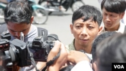 Pa Nguon Teang, founder and executive director of the Cambodian Center for Independent Media (CCIM), talks to reporters in front of Phnom Penh Municipal Court, Phnom Penh, Cambodia, Thursday, August 18, 2016. (Leng Len/VOA Khmer)