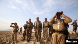 Kurdski vojnici u okolini gradića Makmur, južno od Irbila, pošto su naterali borce Islamske države na povlačenje