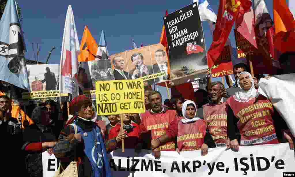 Antiwar protesters demonstrate in front of the Turkish Parliament in Ankara, Oct. 2, 2014.