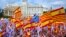 SPAIN - Demonstrators hold Spanish and Catalonian flags as they take part in a rally to mark Spain's National Day in Barcelona, northeastern Spain, 12 October 2017