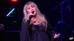 FILE - This image made from video shows singer Stevie Nicks singing "Rhiannon" during a surprise performance after the curtain call for the musical "School of Rock," April 26, 2016, in New York. 