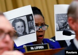 Rep. Sheila Jackson Lee (D-TX) holds up pictures of women who've accused U.S. Senate candidate Roy Moore of sexual misconduct, while questioning U.S. Attorney General Jeff Sessions (Not Pictured) during the House Judiciary Committee oversight hearing on