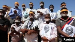Somali journalists, in Mogadishu on Jan. 27, 2013, demand the release of Abdiaziz Abdinur Ibrahim, who was arrested after reporting on an alleged rape case involving government soldiers. 