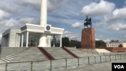 Kyrgyz honor guards stand under the Kyrgyz flag on the Ala-Too square in Bishkek on Oct. 10, 2024. Kyrgyz security services closely cooperated with Russian security forces to locate and arrest Russian war critics.