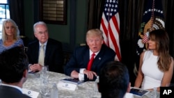 President Donald Trump speaks during a briefing on the opioid crisis, Aug. 8, 2017, at Trump National Golf Club in Bedminster, N.J. From left are, White House senior adviser Kellyanne Conway, Health and Human Services Secretary Tom Price, Trump, and first lady Melania Trump.