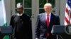 President Donald Trump and Nigerian President Muhammadu Buhari arrive for a news conference in the White House Rose Garden in Washington, April 30, 2018. 