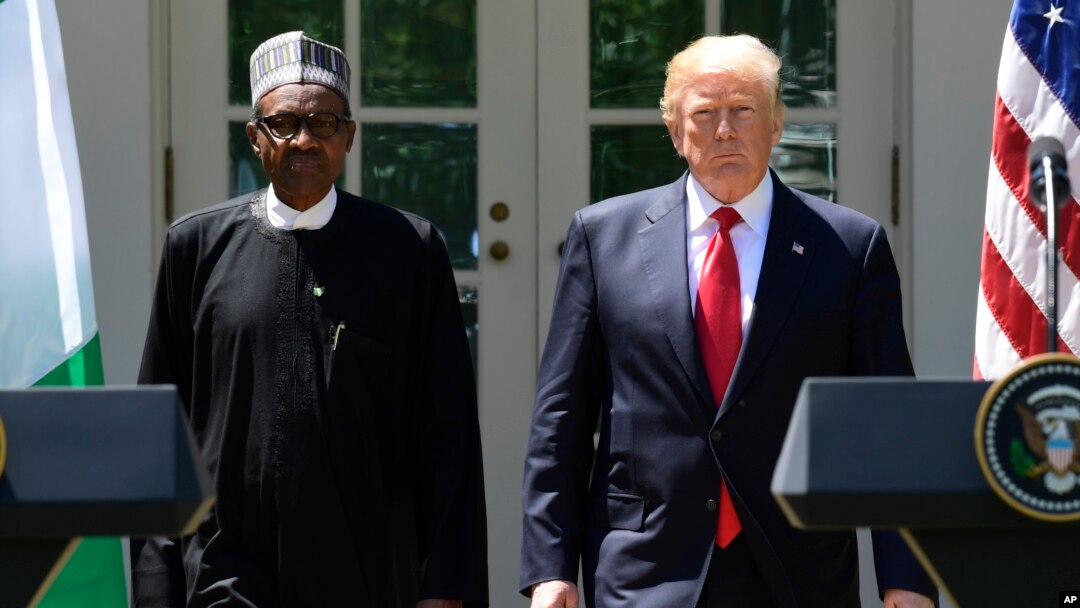 President Donald Trump and Nigerian President Muhammadu Buhari arrive for a news conference in the White House Rose Garden in Washington, April 30, 2018. 