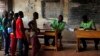 Voters queue to cast their ballots in the second round of presidential election and the fourth district of Bangui, Central African Republic, Feb. 14, 2016. 