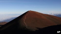 FILE - The summit of Mauna Kea is seen in Hawaii, July 14, 2019. Activists say they're protecting Mauna Kea from being the site of a proposed 30-meter telescope.