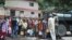 Indian residents gather to collect drinking water in buckets from an Indian Army water tanker as the city faces water shortage in Shimla, in the northern state of Himachal Pradesh, June 2, 2018. 